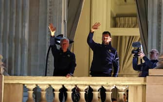 Coach Didier Deschamps , Hugo Lloris of Team France react with fans at the balcony of the Hotel de Crillon during the meeting with French fans at Place de la Concorde on December 19, 2022 in Paris, France.