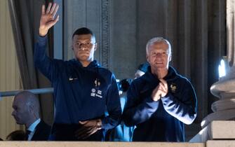 France forward Kylian Mbappe and France coach Didier Deschamps greet supporters at the Hotel de Crillon, a day after the Qatar 2022 World Cup final match against Argentina, at the Place de la Concorde in central Paris on December 19, 2022. Photo by Raphael Lafargue/ABACAPRESS.COM