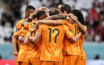 epa10336631 Frenkie de Jong of the Netherlands (unseen) celebrates with his teammates after scoring the 2-0 goal during the FIFA World Cup 2022 group A soccer match between the Netherlands and Qatar at Al Bayt Stadium in Al Khor, Qatar, 29 November 2022.  EPA/Noushad Thekkayil