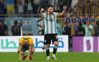 Argentina's Lionel Messi (right) celebrates as Australia's Mitchell Duke looks dejected after the FIFA World Cup round of 16 match at the Ahmad Bin Ali Stadium in Al Rayyan, Qatar. Picture date: Saturday December 3, 2022.