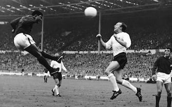 Eusebio of Portugal (left) and Nobby Stiles of England (right) challenge each other for a header. The 2-1 win for England put them in the Final of the World Cup.