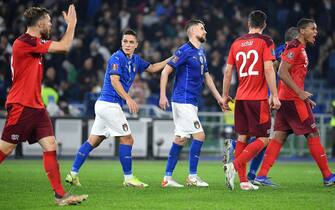 Italy's Giacomo Raspadori (L) consoles his teammate Jorginho after he missed a penalty during the 2022 FIFA World Cup European qualifying  Group C soccer match between Italy and Switzerland at the Olimpico stadium in Rome, Italy, 12 November 2021.  ANSA/ETTORE FERRARI