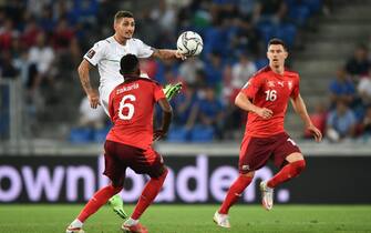 Italy's midfielder Marco Verratti controls the ball next to Switzerland's midfielder Denis Zakaria and Switzerland's midfielder Christian Fassnacht during the World Cup 2022 qualifier football match between Switzerland and Italy, on September 5, 2021 at St Jakob-Park stadium in Basel. (Photo by Fabrice COFFRINI / AFP) (Photo by FABRICE COFFRINI/AFP via Getty Images)
