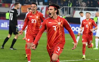 epa09582277 North Macedonia’s Elif Elmas (C) reacts with teammates after scoring the 3-1 lead during the FIFA World Cup 2022 qualifying group J soccer match between North Macedonia and Iceland in Skopje, Republic of North Macedonia, 14 November 2021.  EPA/NAKE BATEV