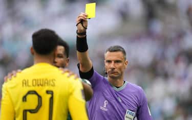 Te referee shows yellow card to Alowais Mohammed of Saudi Arabia during the Qatar 2022 World Cup match, group C, date 1, between Argentina and Arabia Saudita played at Lusail Stadium on Nov 22, 2022 in Lusail, Qatar. (Photo by Bagu Blanco / PRESSINPHOTO/Sipa USA)
