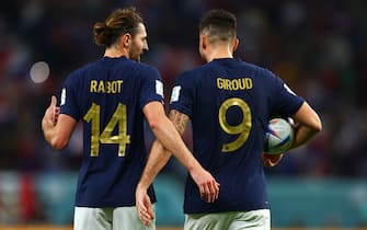 22 November 2022, Qatar, Al Wakrah: Soccer: World Cup, France - Australia, Preliminary Round, Group D, Matchday 1, al-Janoub Stadium, the two goal scorers Adrien Rabiot (l) of France and Olivier Giroud of France walk side by side across the pitch. Photo: Tom Weller/dpa