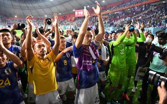 epa10343215 Players of Japan applaud their fans after winning the FIFA World Cup 2022 group E soccer match between Japan and Spain at Khalifa International Stadium in Doha, Qatar, 01 December 2022.  EPA/Neil Hall