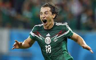 epa04276217 Andres Guardado of Mexico celebrates a goal during the FIFA World Cup 2014 group A preliminary round match between Croatia and Mexico at the Arena Pernambuco in Recife, Brazil, 23 June 2014. 

(RESTRICTIONS APPLY: Editorial Use Only, not used in association with any commercial entity - Images must not be used in any form of alert service or push service of any kind including via mobile alert services, downloads to mobile devices or MMS messaging - Images must appear as still images and must not emulate match action video footage - No alteration is made to, and no text or image is superimposed over, any published image which: (a) intentionally obscures or removes a sponsor identification image; or (b) adds or overlays the commercial identification of any third party which is not officially associated with the FIFA World Cup)  EPA/CHEMA MOYA   EDITORIAL USE ONLY