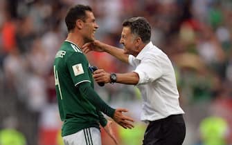 epa06816509 Mexico's coach Juan Carlos Osorio (R) reacts with Rafael Marquez of Mexico after winning the FIFA World Cup 2018 group F preliminary round soccer match between Germany and Mexico in Moscow, Russia, 17 June 2018.(RESTRICTIONS APPLY: Editorial Use Only, not used in association with any commercial entity - Images must not be used in any form of alert service or push service of any kind including via mobile alert services, downloads to mobile devices or MMS messaging - Images must appear as still images and must not emulate match action video footage - No alteration is made to, and no text or image is superimposed over, any published image which: (a) intentionally obscures or removes a sponsor identification image; or (b) adds or overlays the commercial identification of any third party which is not officially associated with the FIFA World Cup)  EPA/PETER POWELL   EDITORIAL USE ONLY  EDITORIAL USE ONLY