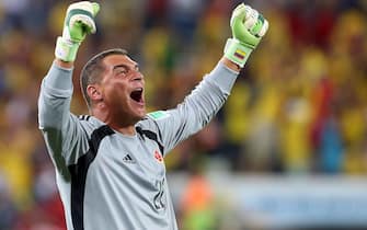 epa04279123 Goalkeeper Faryd Mondragon of Colombia reacts during the FIFA World Cup 2014 group C preliminary round match between Japan and Colombia at the Arena Pantanal in Cuiaba, Brazil, 24 June 2014. (RESTRICTIONS APPLY: Editorial Use Only, not used in association with any commercial entity - Images must not be used in any form of alert service or push service of any kind including via mobile alert services, downloads to mobile devices or MMS messaging - Images must appear as still images and must not emulate match action video footage - No alteration is made to, and no text or image is superimposed over, any published image which: (a) intentionally obscures or removes a sponsor identification image; or (b) adds or overlays the commercial identification of any third party which is not officially associated with the FIFA World Cup)  EPA/JOSE COELHO   EDITORIAL USE ONLY
