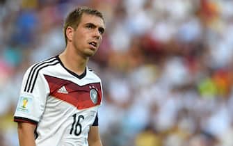 epa04314371 Philipp Lahm of Germany reacts during the FIFA World Cup 2014 final between Germany and Argentina at the Estadio do Maracana in Rio de Janeiro, Brazil, 13 July 2014. (RESTRICTIONS APPLY: Editorial Use Only, not used in association with any commercial entity - Images must not be used in any form of alert service or push service of any kind including via mobile alert services, downloads to mobile devices or MMS messaging - Images must appear as still images and must not emulate match action video footage - No alteration is made to, and no text or image is superimposed over, any published image which: (a) intentionally obscures or removes a sponsor identification image; or (b) adds or overlays the commercial identification of any third party which is not officially associated with the FIFA World Cup)  EPA/ANDREAS GEBERT   EDITORIAL USE ONLY