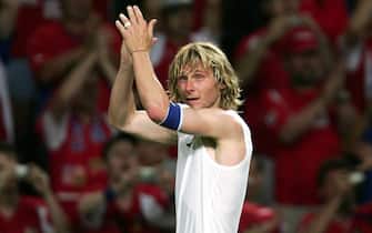 epa000221573 Czech captain Pavel Nedved applauds supporters after the EURO 2004 quarter final match between Czech Republic and Denmark at the Dragao stadium in Porto, Sunday 27 June 2004. The Czech Republic won 3-0.  EPA/FILIPPO MONTEFORTE NO MOBILE PHONE APPLICATIONS