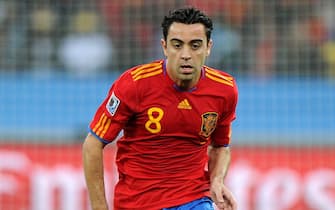 epa02205472 Spain's Xavi in action during the FIFA World Cup 2010 group H preliminary round match between Spain and Switzerland at the Durban stadium in Durban, South Africa, 16 June 2010.  EPA/DANIEL DAL ZENNARO Please refer to www.epa.eu/downloads/FIFA-WorldCup2010-Terms-and-Conditions.pdf