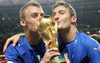 Italian Daniele de Rossi and Francesco Totti (R) celebrate after the final of the 2006 FIFA World Cup between Italy and France at the Olympic Stadium in Berlin, Germany, Sunday 09 July 2006. Italy won after extra time (1-1) on penalty shoot-out 5-3. ANSA/ROLAND WEIHRAUCH 