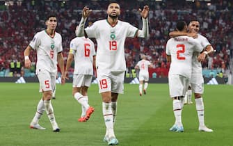 epa10341659 Youssef En-Nesyri (2-L) of Morocco celebrates after scoring the team's second goal during the FIFA World Cup 2022 group F soccer match between Canada and Morocco at Al Thumama Stadium in Doha, Qatar, 01 December 2022.  EPA/Mohamed Messara