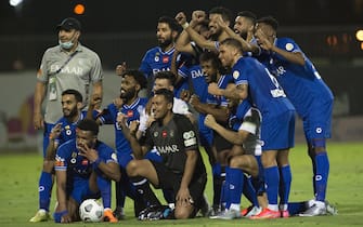 epa09184335 Al-Hilal players pose for a photo at the end of the Saudi Professional League soccer match between Al-Shabab and Al-Hilal at Al-Shabab Club Stadium, Riyadh, Saudi Arabia, 07 May 2021.  EPA/STRINGER