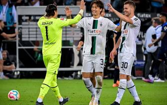 GERMANY SOCCER BUNDESLIGA epa10129876 (L-R) Moenchengladbach's goalkeeper Yann Sommer, Ko Itakura and Nico Elvedi react after winning the German Bundesliga soccer match between Borussia Moenchengladbach and Hertha BSC in Moenchengladbach, Germany, 19 August 2022. EPA/SASCHA STEINBACH CONDITIONS - ATTENTION: The DFL regulations prohibit any use of photographs as image sequences and/or quasi-video.