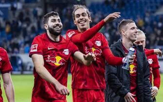05 November 2022, Baden-Wuerttemberg, Sinsheim: Soccer: Bundesliga, TSG 1899 Hoffenheim - RB Leipzig, Matchday 13, PreZero Arena. Leipzig's Josko Gvardiol (l) and Leipzig's Yussuf Poulsen (r) cheer among the fans after the match. Photo: Tom Weller/dpa - IMPORTANT NOTE: In accordance with the requirements of the DFL Deutsche Fußball Liga and the DFB Deutscher Fußball-Bund, it is prohibited to use or have used photographs taken in the stadium and/or of the match in the form of sequence pictures and/or video-like photo series.