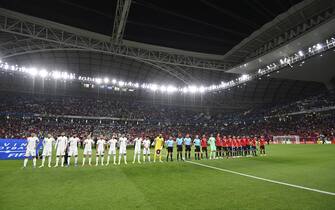 epa09627795 Players of Algeria (L) and Egypt (R) line up before the FIFA Arab Cup group D soccer match between Algeria and Egypt at the Al Janoub stadium in Al Wakrah, Qatar, 07 December 2021.  EPA/Noushad Thekkayil