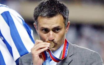 FC Porto Coach Jose Mourinho kisses his medal after Portuguese side Porto won the UEFA Cup for the first time in their history in Seville on Wednesday, 21 May 2003. Porto beat Celtic 3-2.   EPA-PHOTO/LUSA/ANTONIO SIMOES