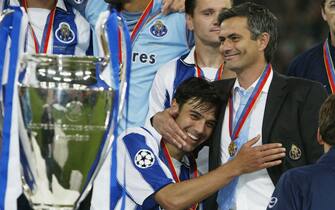 GELSENKIRCHEN, GERMANY - MAY 26:  Nuno Valente of FC Porto hugs his manager Jose Dos Santos Mourinho after winning the Champions League during the UEFA Champions League Final match between AS Monaco and FC Porto at the AufSchake Arena on May 26, 2004 in Gelsenkirchen, Germany.  (Photo by Alex Livesey/Getty Images)