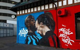 MILAN, ITALY - FEBRUARY 25: A mural is seen on a building outside the stadium of Romelu Lukaku of FC Internazionale as he clashes with Zlatan Ibrahimovic of AC Milan ahead of the UEFA Europa League Round of 32 match between AC Milan and Crvena Zvezda at San Siro Stadium on February 25, 2021 in Milan, Italy. Sporting stadiums around Italy remain under strict restrictions due to the Coronavirus Pandemic as Government social distancing laws prohibit fans inside venues resulting in games being played behind closed doors. (Photo by Marco Luzzani/Getty Images)