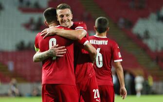 BELGRADE, SERBIA - JUNE 05: Aleksandar Mitrovic of Serbia celebrates with team mate Sergej Milinkovic-Savic after scoring their sides first goal during the UEFA Nations League League B Group 4 match between Serbia and Slovenia at Stadion Rajko MitiÄ  on June 05, 2022 in Belgrade, Serbia. (Photo by Srdjan Stevanovic/Getty Images)
