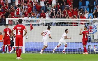 epa10008412 Turkey's Hakan Calhanoglu (2-R) celebrates after scoring the 1-0 lead from the penalty spot during the UEFA Nations League soccer match between Luxembourg and Turkey in Luxembourg, 11 June 2022.  EPA/JULIEN WARNAND