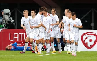 epa09994453 Players of Latvia celebrate a goal during the UEFA Nations League soccer match between Latvia and Andorra at Daugava Stadium in Riga, Latvia, 03 June 2022.  EPA/TOMS KALNINS