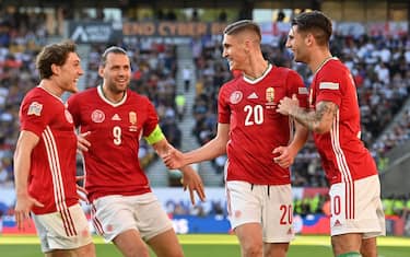 Hungary's midfielder Roland Salai (2nd R) celebrates with teammates after scoring the opening goal of the UEFA Nations League, league A group 3 football match between England and Hungary at Molineux Stadium in Wolverhampton, central England on June 14, 2022. - NOT FOR MARKETING OR ADVERTISING USE / RESTRICTED TO EDITORIAL USE (Photo by Paul ELLIS / AFP) / NOT FOR MARKETING OR ADVERTISING USE / RESTRICTED TO EDITORIAL USE (Photo by PAUL ELLIS/AFP via Getty Images)