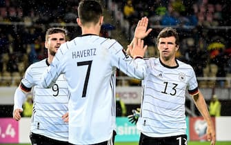 epa09519179 Germany's Kai Havertz (C) celebrates with his teammates after scoring the 1-0 lead during the FIFA World Cup Qatar 2022 qualifying Group J soccer match between North Macedonia and Germany in Skopje, Republic of North Macedonia, 11 October 2021.  EPA/GEORGI LICOVSKI