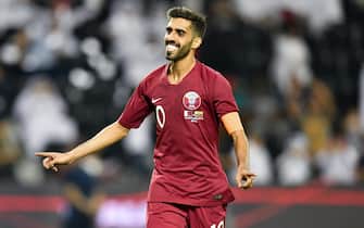 epa07089238 Hassan Al Haydos of Qatar celebrates after scoring a goal during the international friendly soccer match between Qatar and Ecuador at Jassim Bin Hamad Stadium, in Doha, Qatar, 12 October 2018.  EPA/NOUSHAD THEKKAYIL