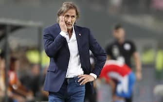 epa09859886 Coach Ricardo Gareca of Peru reacts, during a soccer match of the South American qualifiers for the Qatar 2022 World Cup between Peru and Paraguay, at the National Stadium in Lima, Peru, 29 March 2022.  EPA/Paolo Aguilar