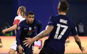 France's forward Kylian Mbappe (L) reacts after scoring a goal  during the UEFA Nations League Group A3 football match between Croatia and France at the Maksimir Stadium in Zagreb on October 14, 2020. (Photo by FRANCK FIFE / AFP) (Photo by FRANCK FIFE/AFP via Getty Images)