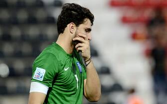 epa03771618 Goalkeeper Stefanos Kapino of Greece shows his dejection after Greece lost 1:3 against Uzbekistan during the FIFA Under 20 World Cup 2013 round of 16 soccer match between Greece and Uzbekistan at the Gaziantep Kamil Ocak stadium in Gaziantep, Turkey, 02 July 2013.  EPA/FILIP SINGER
