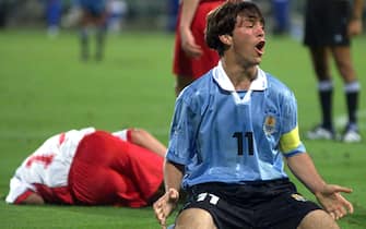 AUCKLAND, NEW ZEALAND - NOVEMBER 11:  Uruguay's captain Horacio Peralta shows his frustration at the outcome of his tackle with Poland's Sebastian Mila who also lies on the ground during their match in the U17 World Soccer Champs played at the North Harbour Stadium on Thursday.The match ended in a one all draw.DIGITAL IMAGE.  (Photo by Phil Walter/Getty Images)