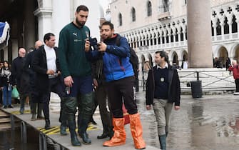 VENICE, ITALY - NOVEMBER 16:  Gianluigi Donnarumma of Italy poses for a photo as he visits Venice during the high water on November 16, 2019 in Venice, Italy.  (Photo by Claudio Villa/Getty Images)