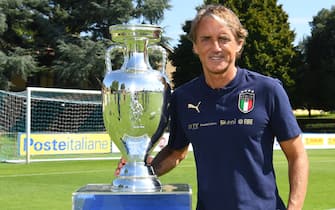 FLORENCE, ITALY - SEPTEMBER 03: Head coach Italy Roberto Mancini poses for the official photo with their EURO2020 Cup winnings at Centro Tecnico Federale di Coverciano on September 03, 2021 in Florence, Italy. (Photo by Claudio Villa/Getty Images)