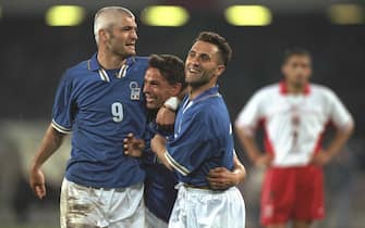 1620628 30 Apr 1997: Roberto Baggio of Italy (centre) is congratulated by Fabrizio Ravanelli (left) and Angelo Di Livio after his goal during the World Cup Qualifier against Poland in Naples, Italy. Italy won 3-0. \ Mandatory Credit: Ben Radford /Allsport
