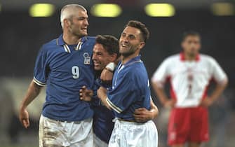 30 Apr 1997:  Roberto Baggio of Italy (centre) is congratulated by Fabrizio Ravanelli (left) and Angelo Di Livio after his goal during the World Cup Qualifier against Poland in Naples, Italy. Italy won 3-0. \ Mandatory Credit: Ben Radford /Allsport