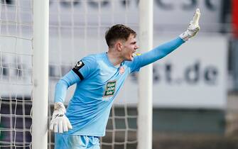12 February 2022, Rhineland-Palatinate, Kaiserslautern: Soccer: 3. league, 1. FC Kaiserslautern - 1. FC Magdeburg, 26. matchday, Fritz-Walter-Stadion. Kaiserslautern goalkeeper Matheo Raab gestures. Photo: Uwe Anspach/dpa - IMPORTANT NOTE: In accordance with the requirements of the DFL Deutsche Fußball Liga and the DFB Deutscher Fußball-Bund, it is prohibited to use or have used photographs taken in the stadium and/or of the match in the form of sequence pictures and/or video-like photo series.