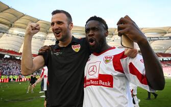 STUTTGART, GERMANY - MAY 14: Orel Mangala of VfB Stuttgart celebrates with staff after their sides victory which results in VfB Stuttgart avoiding the relegation play offs in the Bundesliga match between VfB Stuttgart and 1. FC KÃ¶ln at Mercedes-Benz Arena on May 14, 2022 in Stuttgart, Germany. (Photo by Matthias Hangst/Getty Images)