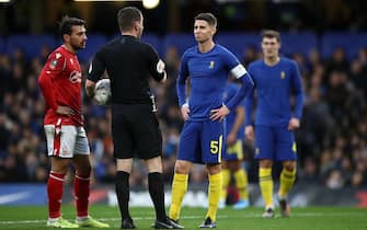 LONDON, ENGLAND - JANUARY 05: Match Referee Peter Bankes speaks with Jorginho of Chelsea whilst they wait for a VAR decision during the FA Cup Third Round match between Chelsea and Nottingham Forest at Stamford Bridge on January 05, 2020 in London, England. (Photo by Bryn Lennon/Getty Images)