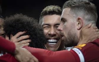 LONDON, ENGLAND - JANUARY 11: Roberto Firmino (centre) celebrates with Mo Salah and Jordan Henderson after scoring the winning goal for Liverpool FC during the Premier League match between Tottenham Hotspur and Liverpool FC at Tottenham Hotspur Stadium on January 11, 2020 in London, United Kingdom. (Photo by Visionhaus)