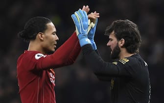 BRITAIN SOCCER ENGLISH PREMIER LEAGUE epa08120286 Liverpool's Virgil van Dijk (L) and Alisson (R) during the English Premier League soccer match between Liverpool and Tottenham Hotspur held at Tottenham Hotspur Stadium in north London, Britain, 11 January 2020. EPA/NEIL HALL EDITORIAL USE ONLY. No use with unauthorized audio, video, data, fixture lists, club/league logos or 'live' services. Online in-match use limited to 120 images, no video emulation. No use in betting, games or single club/league/player publications
