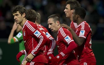 Bayern players celebrate including (from L) midfielder Thomas Mueller, French midfielder Franck Ribery, Croatian striker Mario Mandzukic and Austrian midfielder David Alaba after scoring during the German first division Bundesliga football match between SV Werder Bremen and FC Bayern Munich in Bremen, northern Germany, on December 7, 2013. Bayern Munich won the match 0-7. AFP PHOTO / JOHN MACDOUGALL

DFL RULES TO LIMIT THE ONLINE USAGE DURING MATCH TIME TO 15 PICTURES PER MATCH. IMAGE SEQUENCES TO SIMULATE VIDEO IS NOT ALLOWED AT ANY TIME. FOR FURTHER QUERIES PLEASE CONTACT THE DFL DIRECTLY AT + 49 69 650050.        (Photo credit should read JOHN MACDOUGALL/AFP via Getty Images)