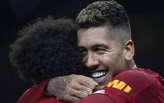 1198887578 LONDON, ENGLAND - JANUARY 11: Roberto Firmino celebrates with Mo Salah after scoring the winning goal for Liverpool FC during the Premier League match between Tottenham Hotspur and Liverpool FC at Tottenham Hotspur Stadium on January 11, 2020 in London, United Kingdom. (Photo by Visionhaus)