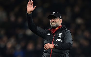 Liverpool's German manager Jurgen Klopp waves at the end of the English Premier League football match between Tottenham Hotspur and Liverpool at Tottenham Hotspur Stadium in London, on January 11, 2020. (Photo by Glyn KIRK / AFP) / RESTRICTED TO EDITORIAL USE. No use with unauthorized audio, video, data, fixture lists, club/league logos or 'live' services. Online in-match use limited to 120 images. An additional 40 images may be used in extra time. No video emulation. Social media in-match use limited to 120 images. An additional 40 images may be used in extra time. No use in betting publications, games or single club/league/player publications. /  (Photo by GLYN KIRK/AFP via Getty Images)