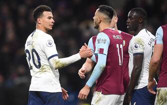 BURNLEY, ENGLAND - MARCH 07: Dele Alli of Tottenham Hotspur shakes hands with Dwight McNeil of Burnley after the Premier League match between Burnley FC and Tottenham Hotspur at Turf Moor on March 07, 2020 in Burnley, United Kingdom. (Photo by Michael Regan/Getty Images)