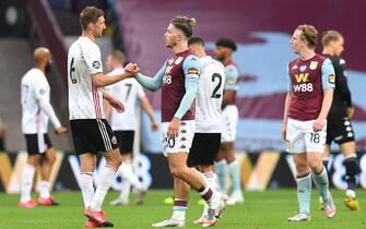 BIRMINGHAM, ENGLAND - JUNE 17: Chris Basham of Sheffield United shakes hands with Jack Grealish of Aston Villa after the Premier League match between Aston Villa and Sheffield United at Villa Park on June 17, 2020 in Birmingham, England. (Photo by Paul Ellis/Pool via Getty Images)